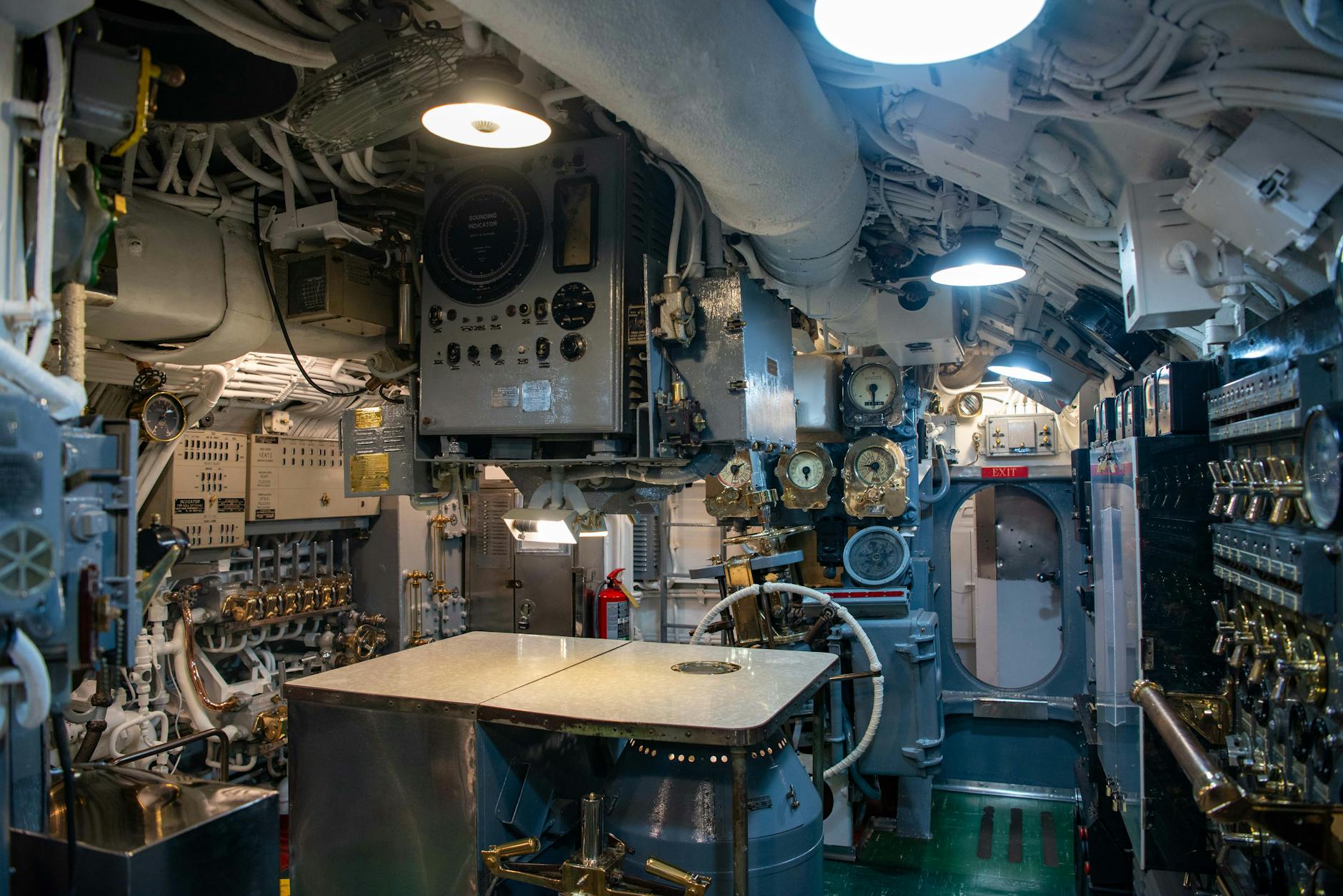 Explore the intricate details of a vintage submarine control room, showcasing complex machinery and gauges.